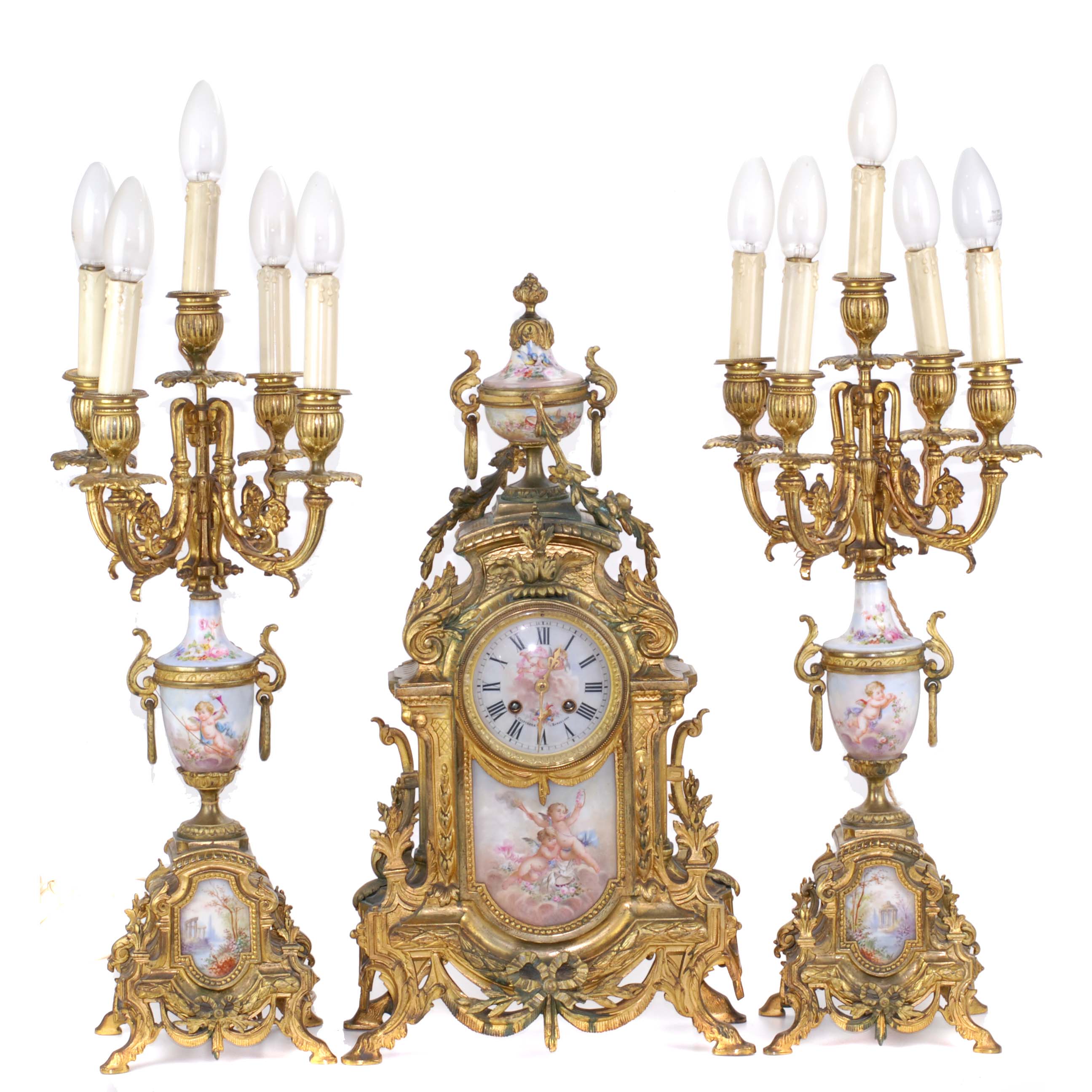 ORNATE BARCELONA CLOCK AND PAIR OF CANDELABRAS. FIRST DECAD