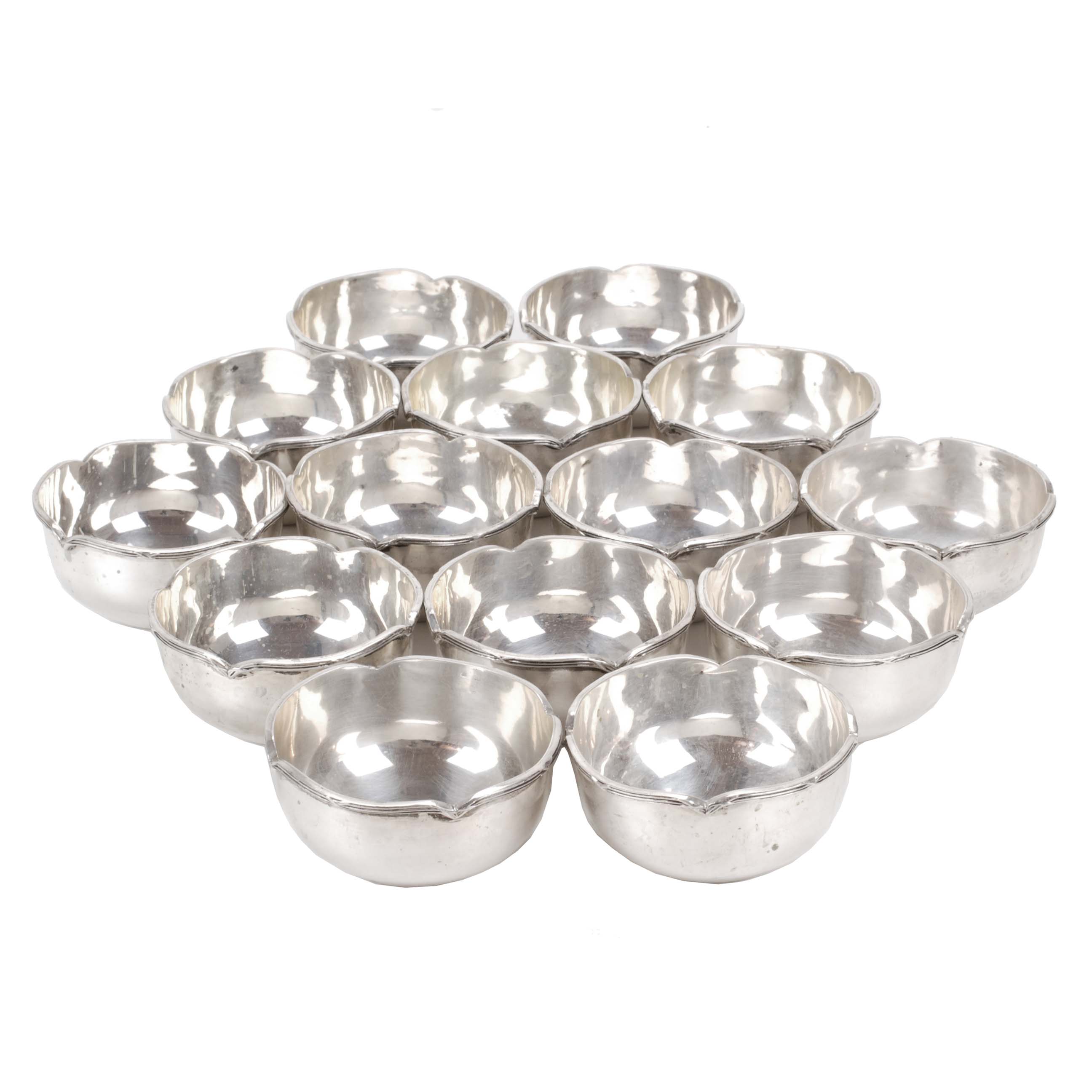 SET OF FOURTEEN EGYPTIAN SILVER FINGER-BOWLS.