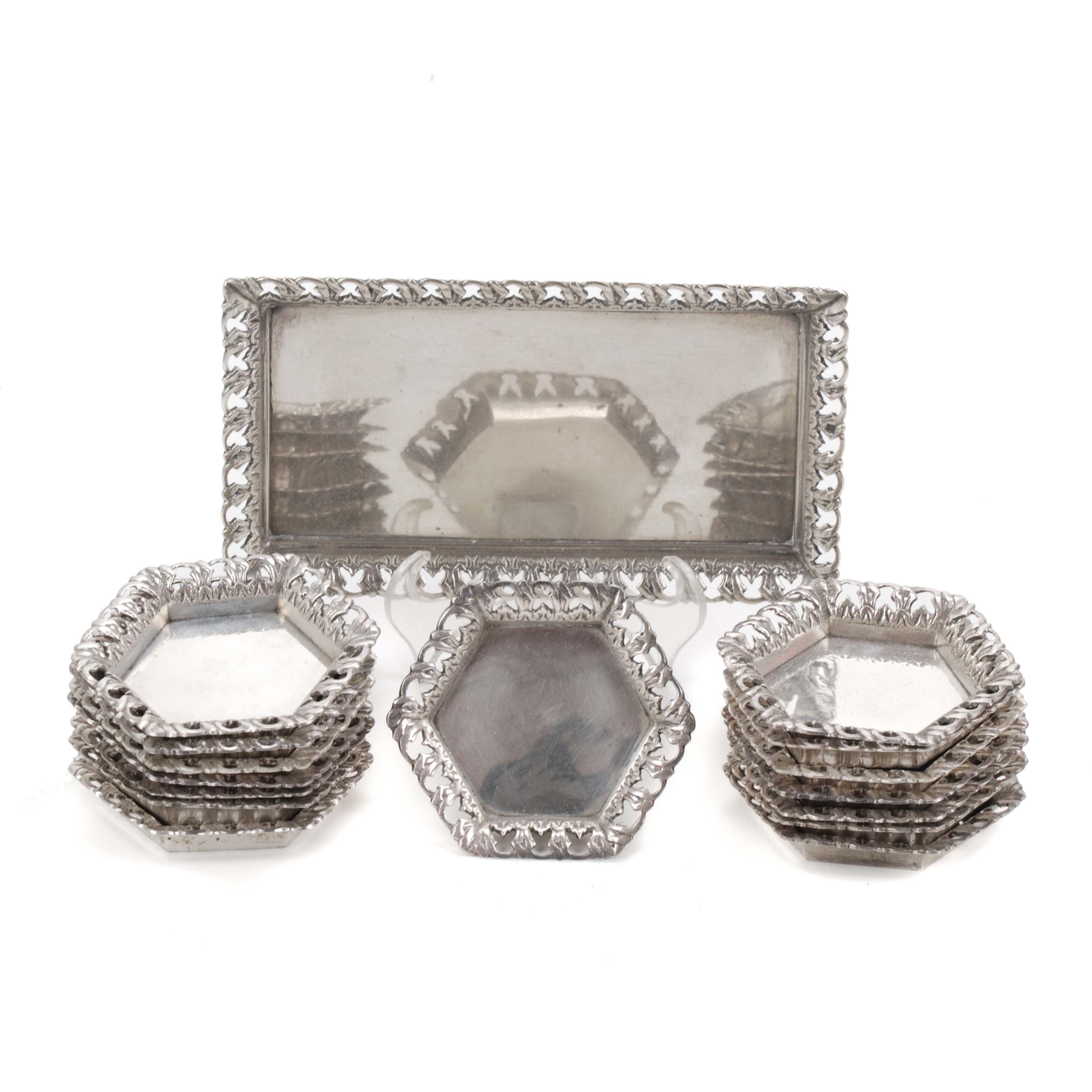 SET OF FIFTEEN SMALL PLATES AND A TRAY, EGYPTIAN SILVER. 