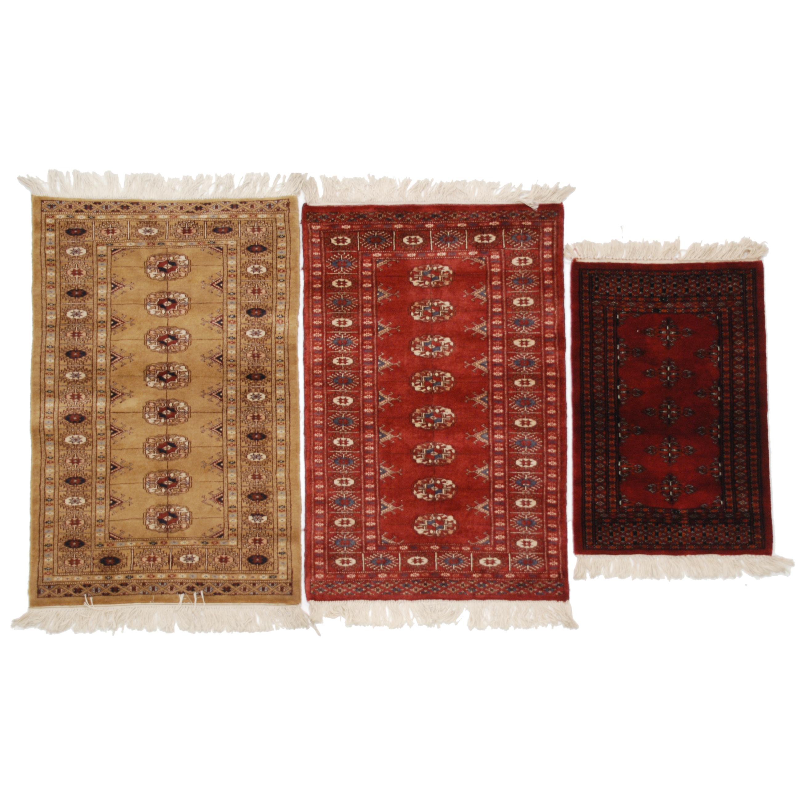 THREE SMALL PAKISTANI CARPETS, C20th.