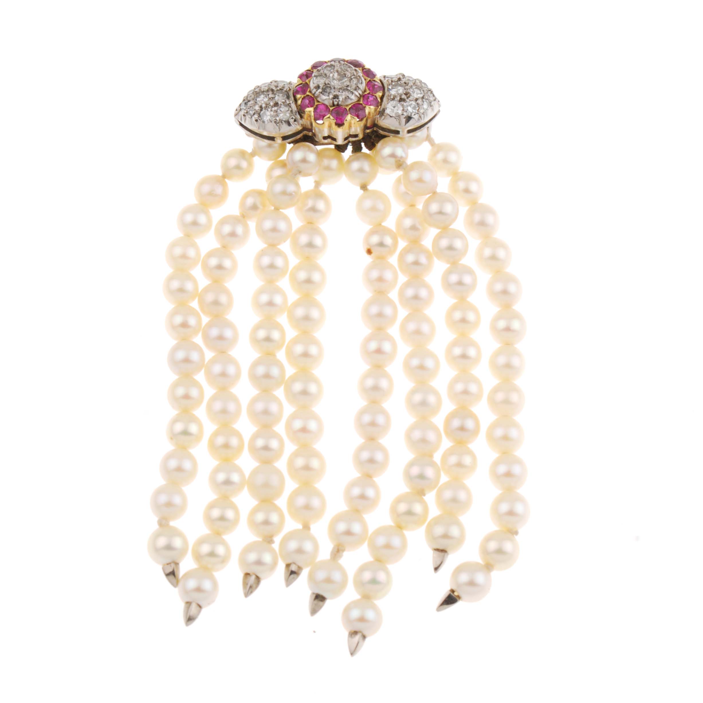 BROOCH WITH STRINGS OF HANGING PEARLS.