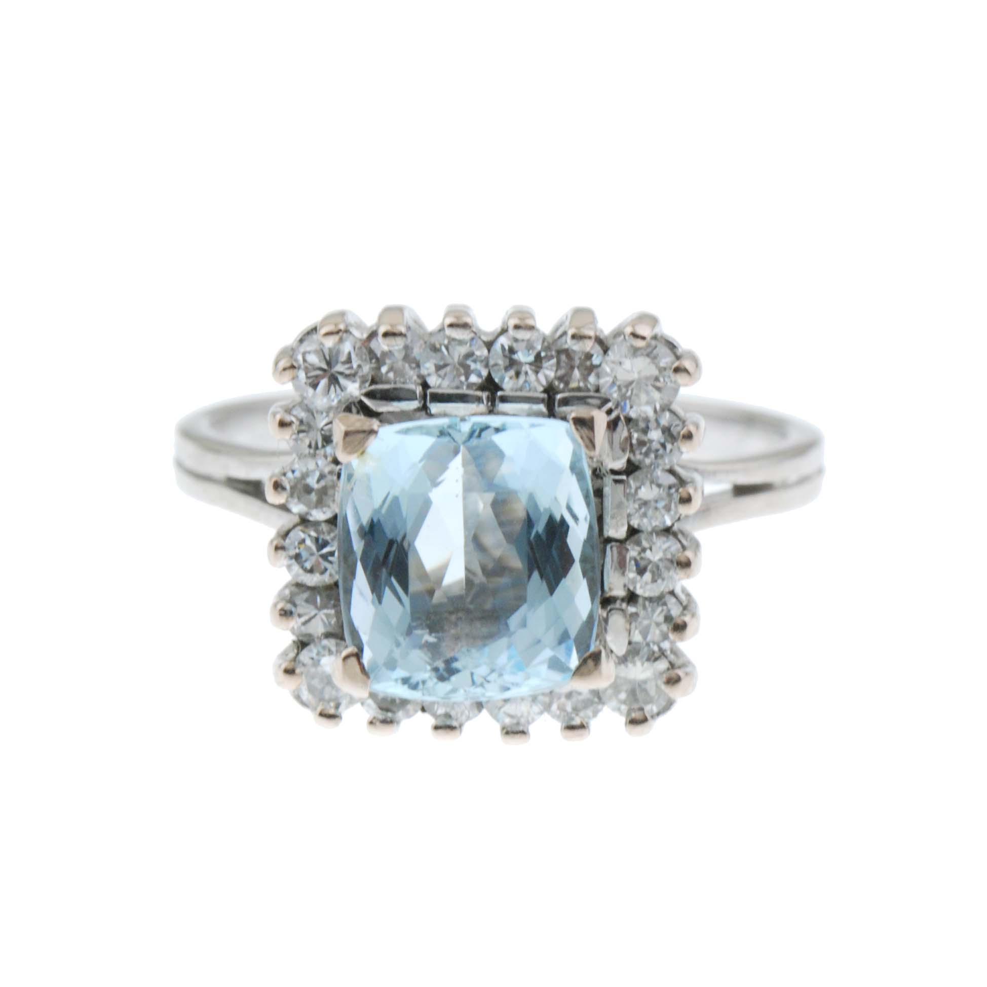 AQUAMARINE AND DIAMOND ROSETTE RING.