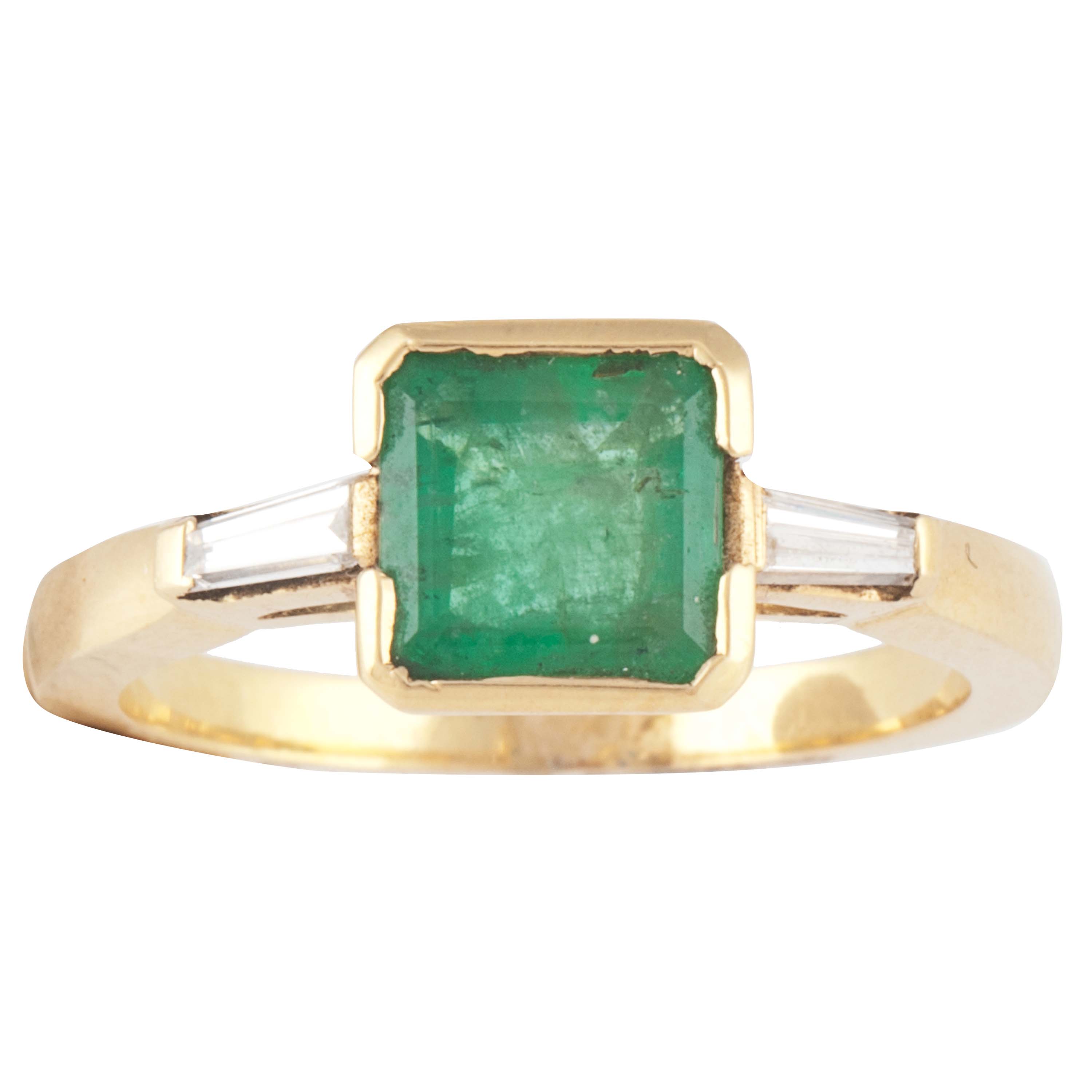 EMERALD AND BAGUETTE RING.