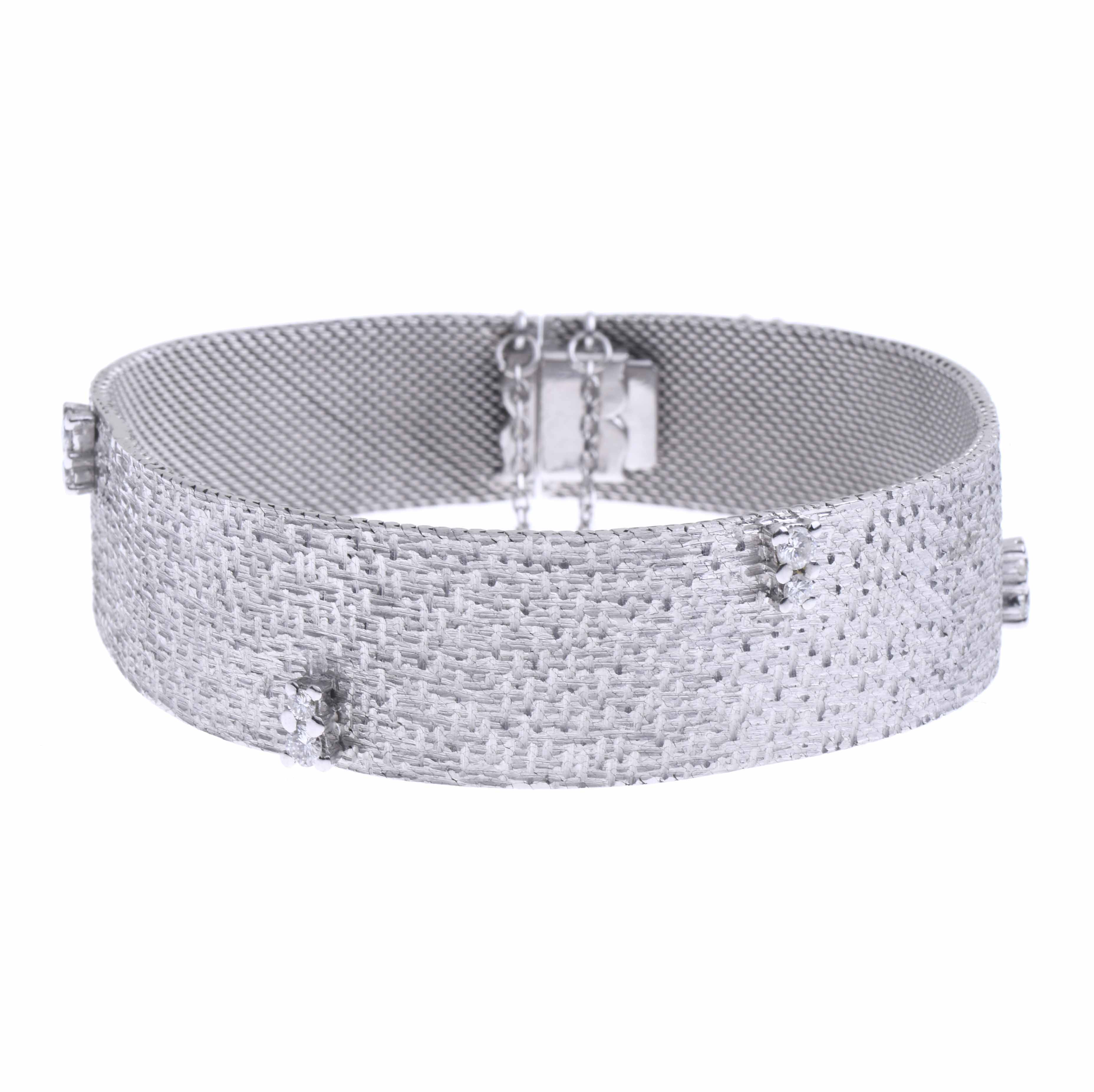 WHITE GOLD AND DIAMONDS SEMI-RIGID BRACELET.