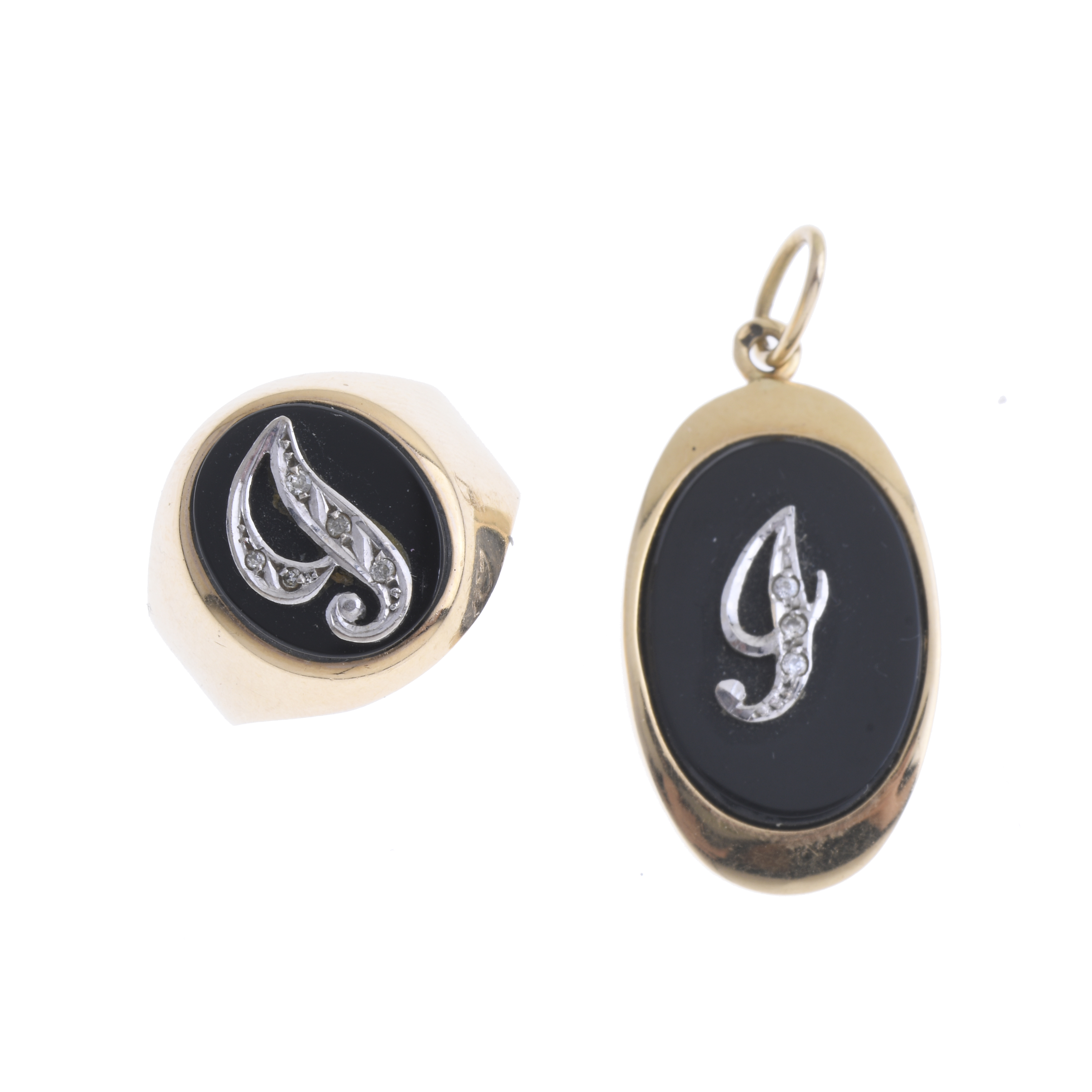 GOLD AND ONYX RING AND PENDANT SET.
