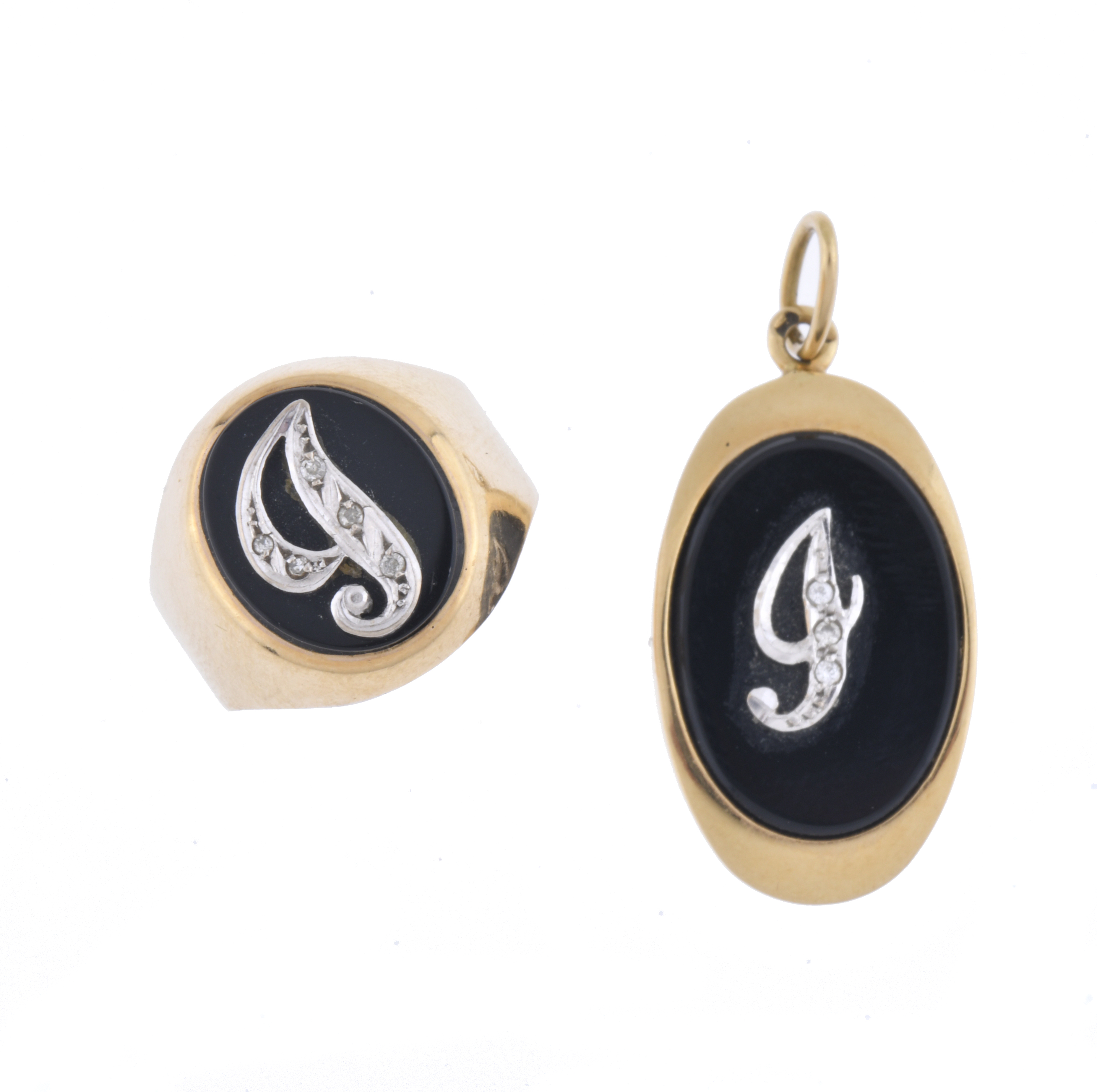 GOLD AND ONYX RING AND PENDANT SET.