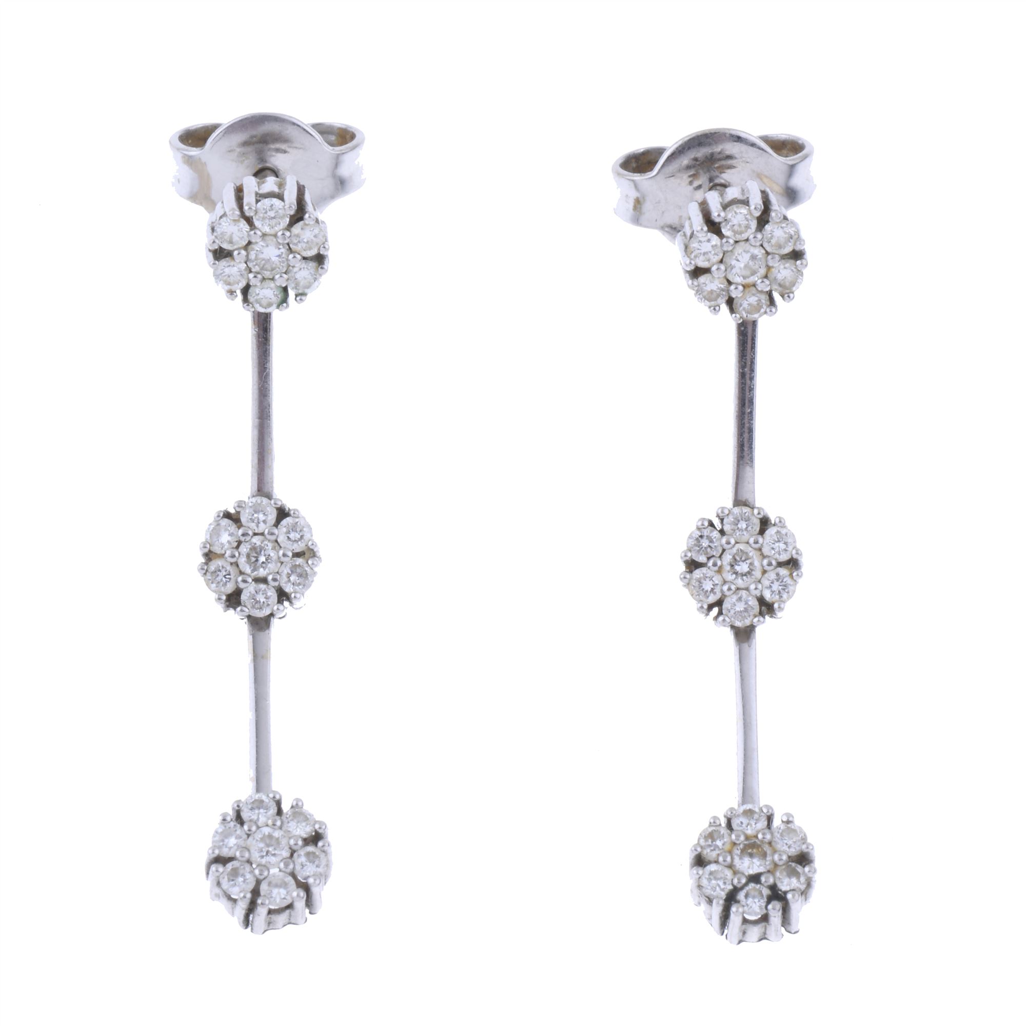 THREE WHITE GOLD ROSETTE EARRINGS.