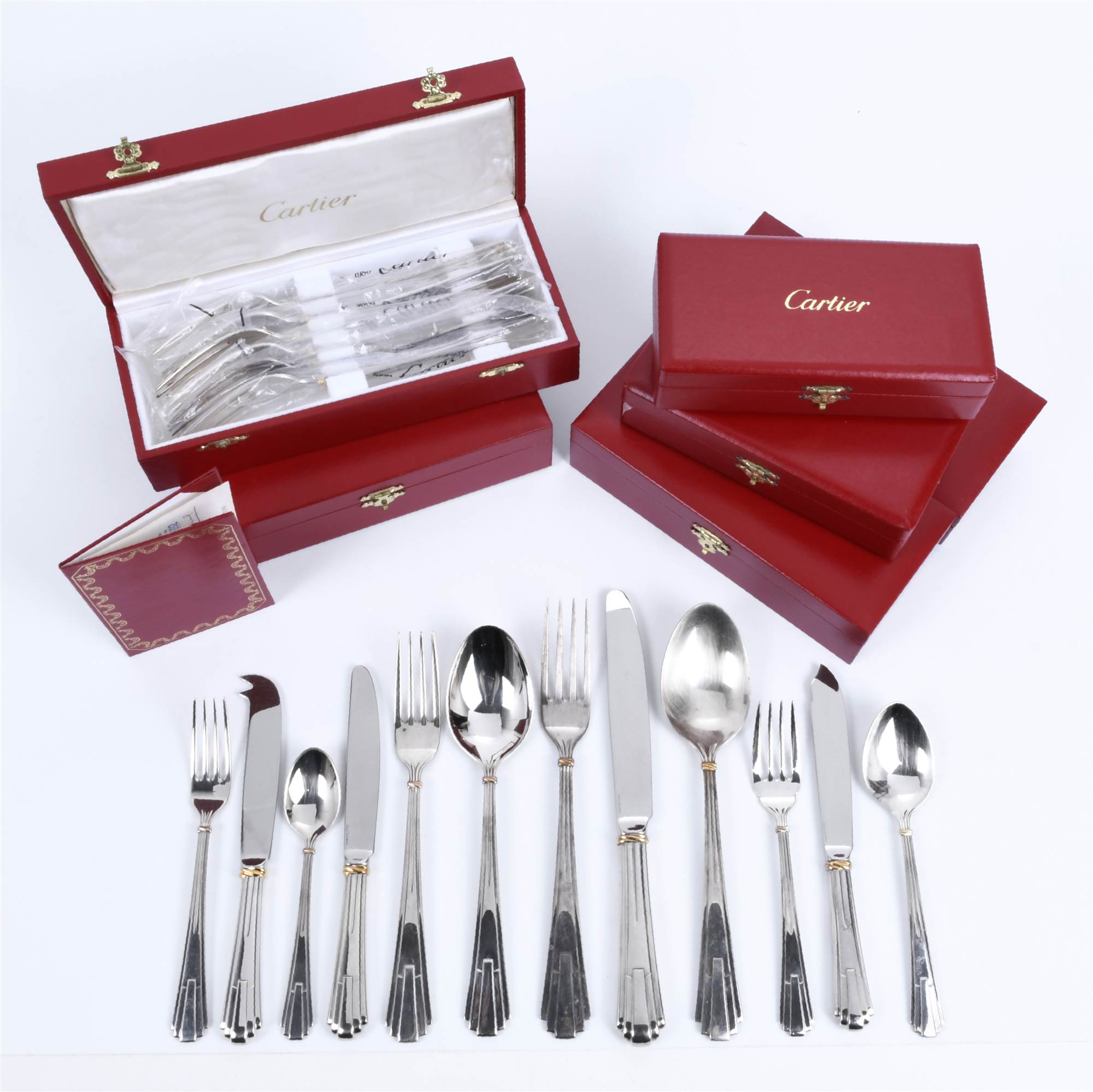 CARTIER. TWELVE-SERVICE CUTLERY SET, "LA MAISON DE LOUIS CA