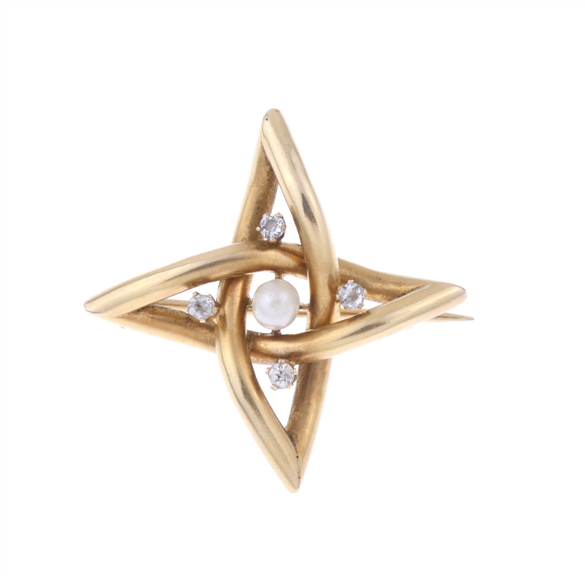 STAR-SHAPED BROOCH IN YELLOW GOLD AND DIAMONDS.