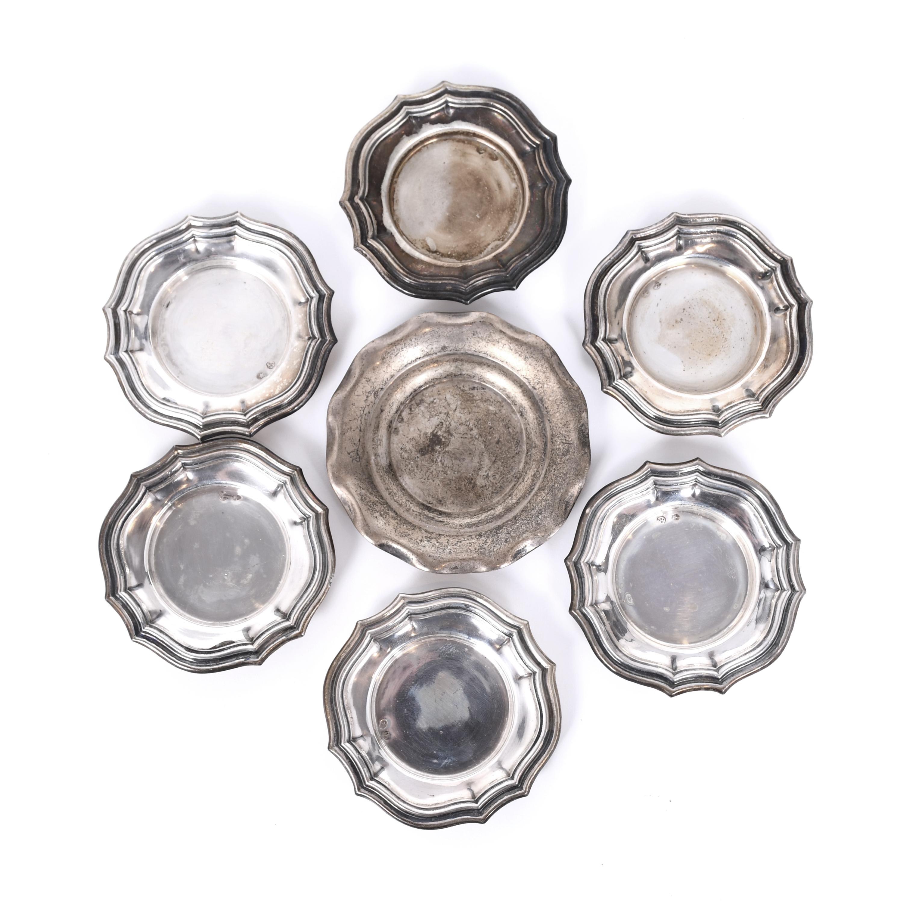 SEVEN SILVER ASHTRAYS, MID 20TH CENTURY.