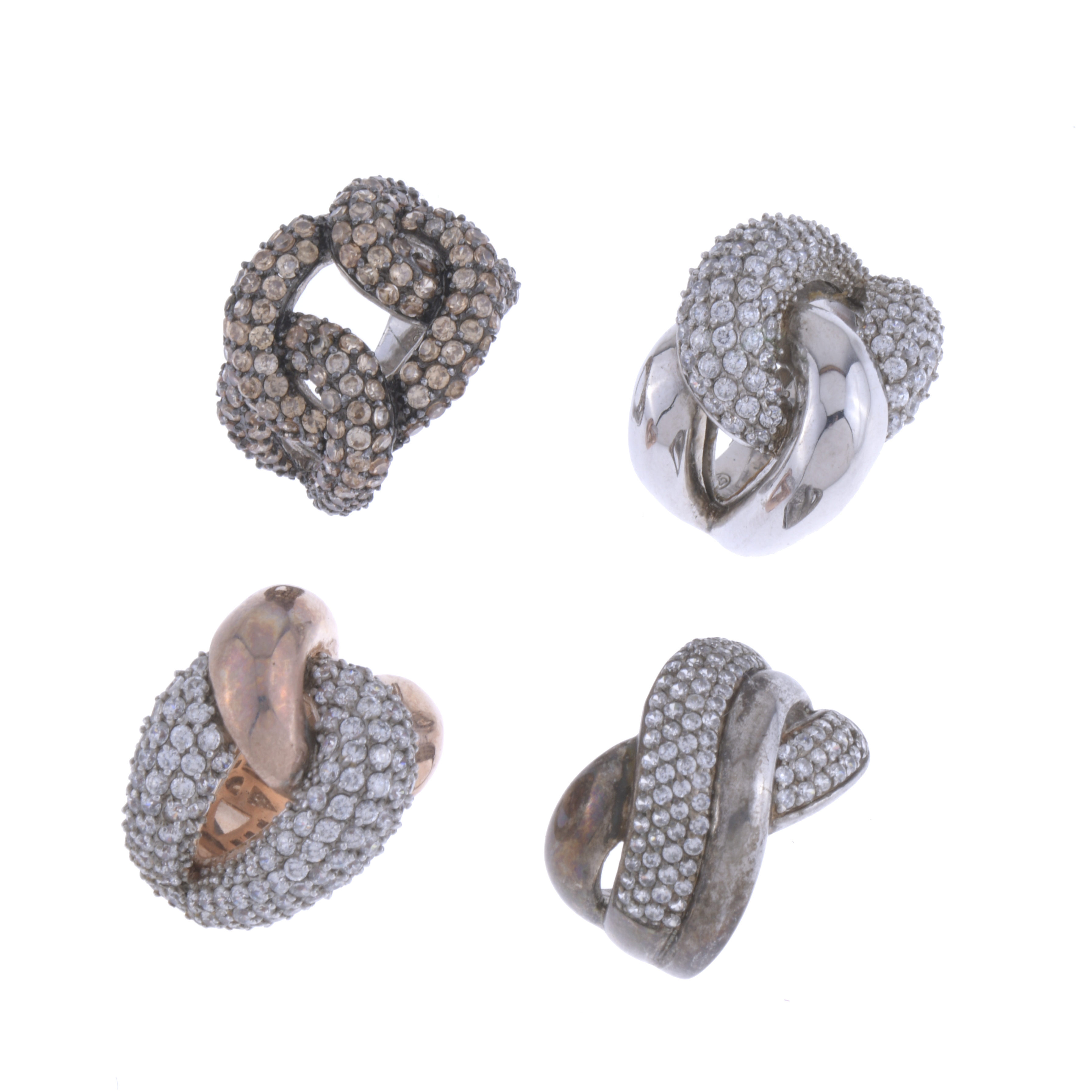 FOUR RHINESTONES RINGS.