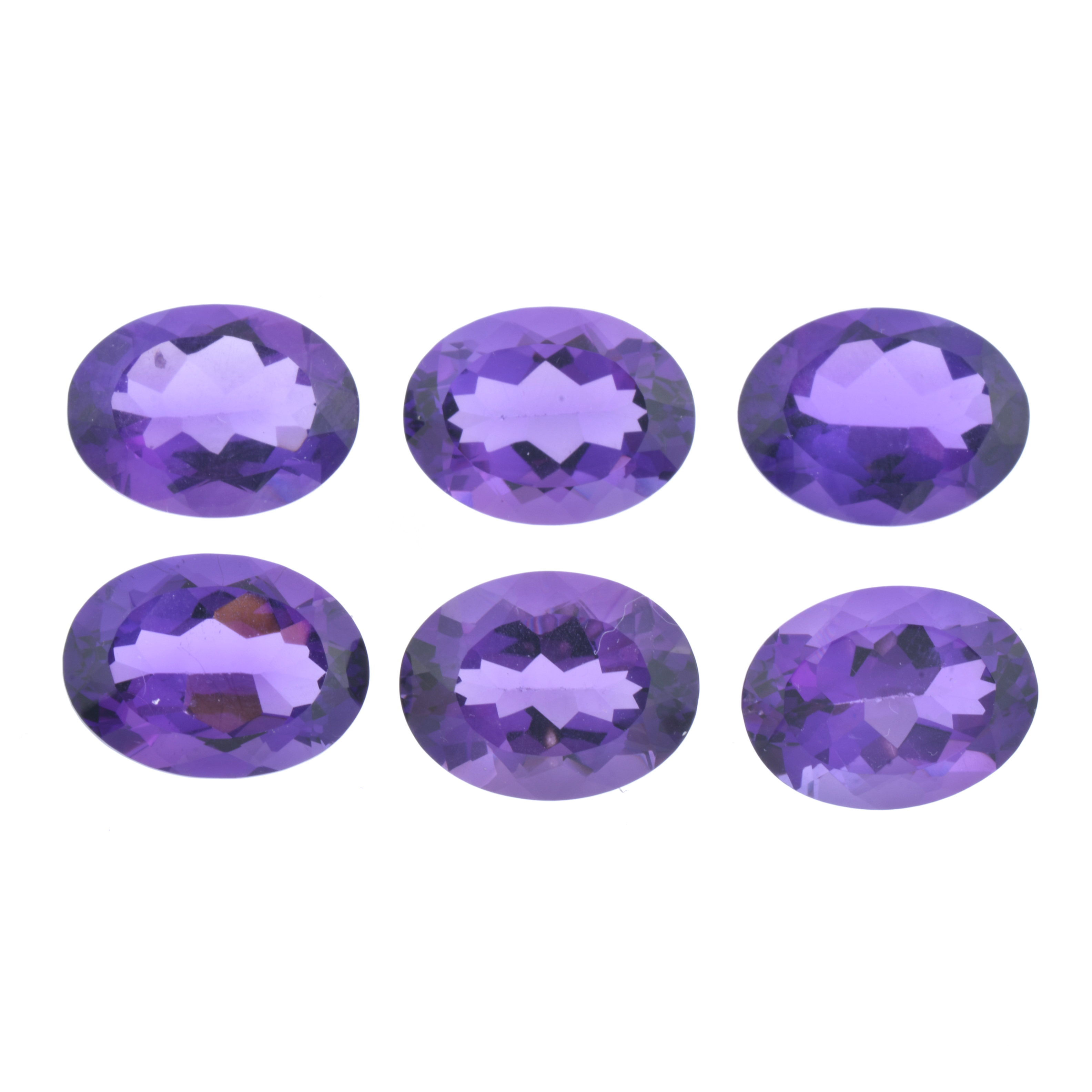Lot of six unmounted amethysts.