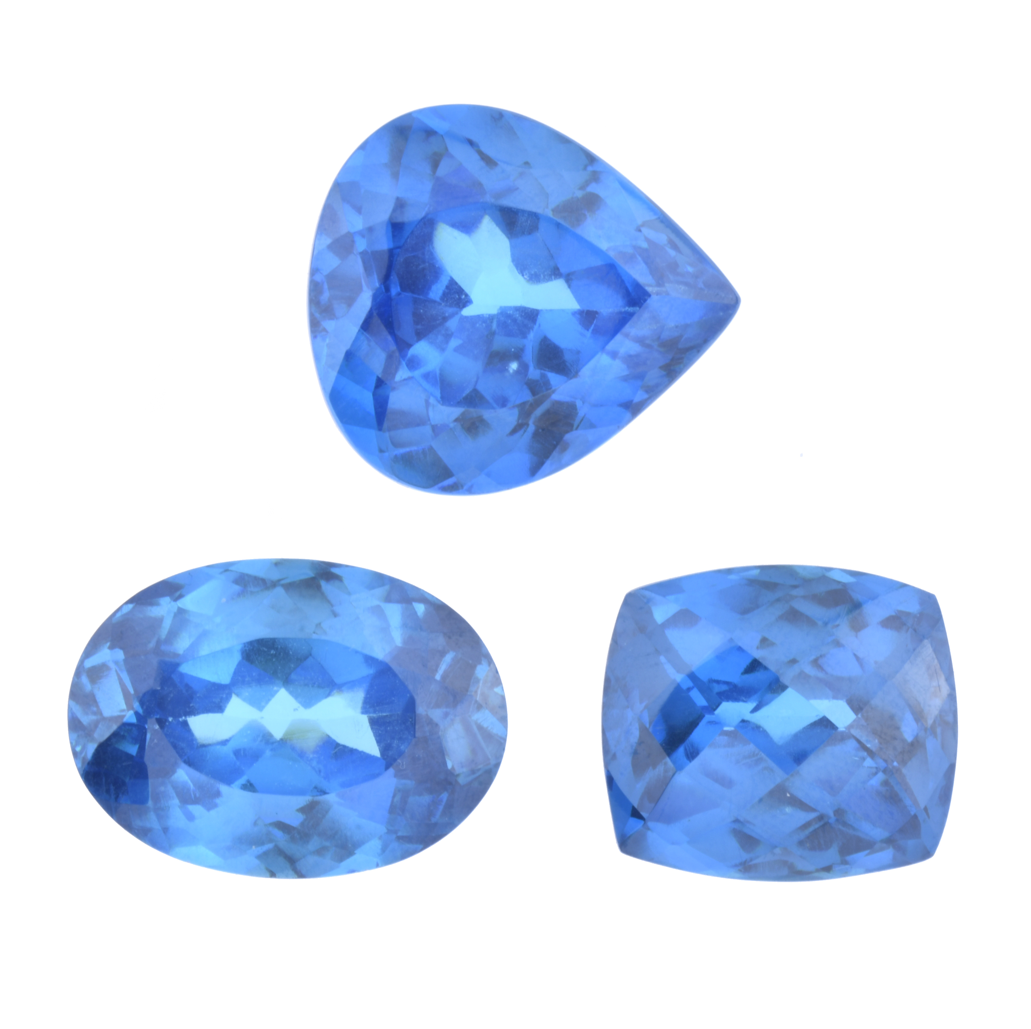 Set of three unmounted London blue topazes.