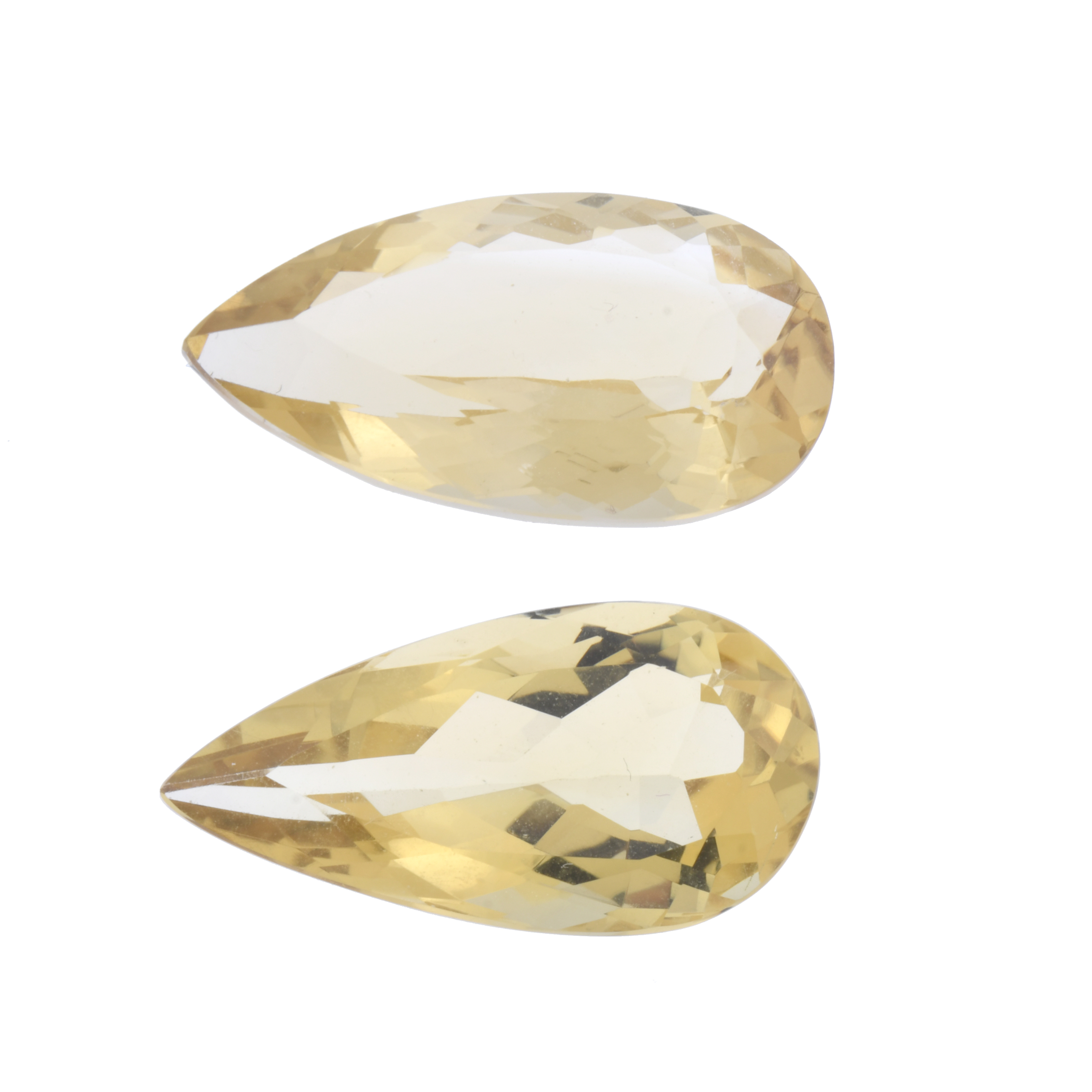 Pair of unmounted pear cut citrines of 24.6 ct and 23.9 ct.