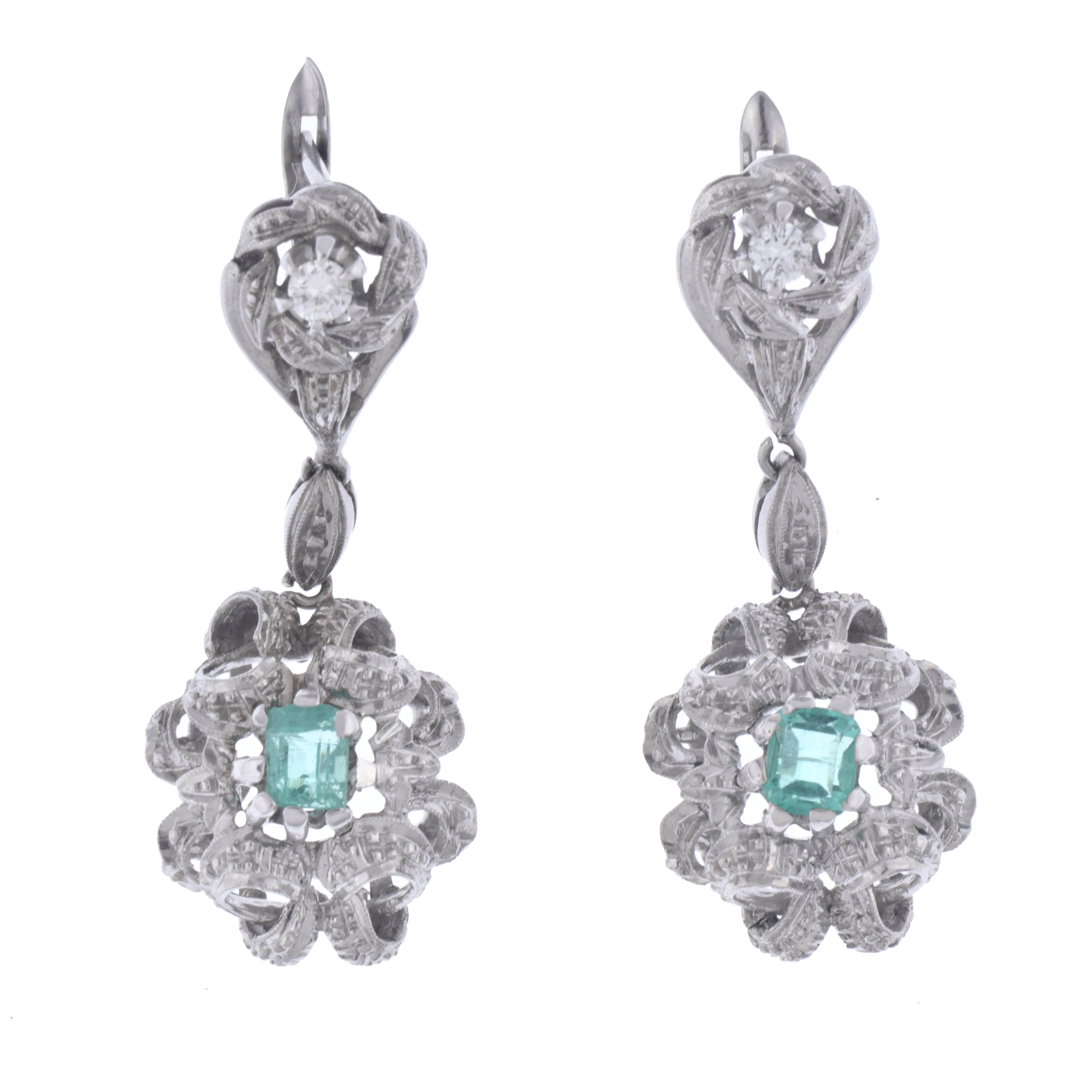 Emeralds and diamonds floral earrings.