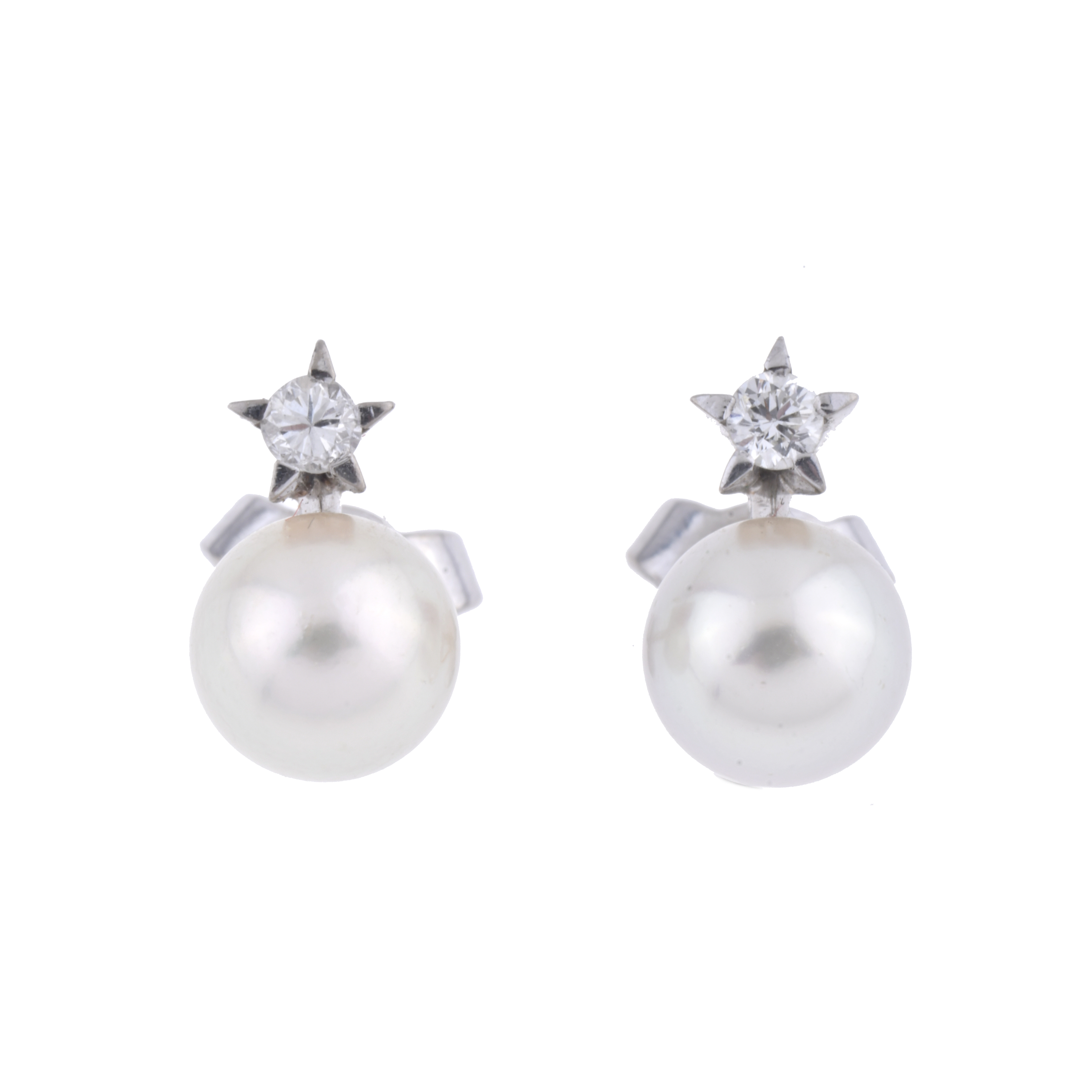 Pendientes tu y yo con perlas y diamantes.