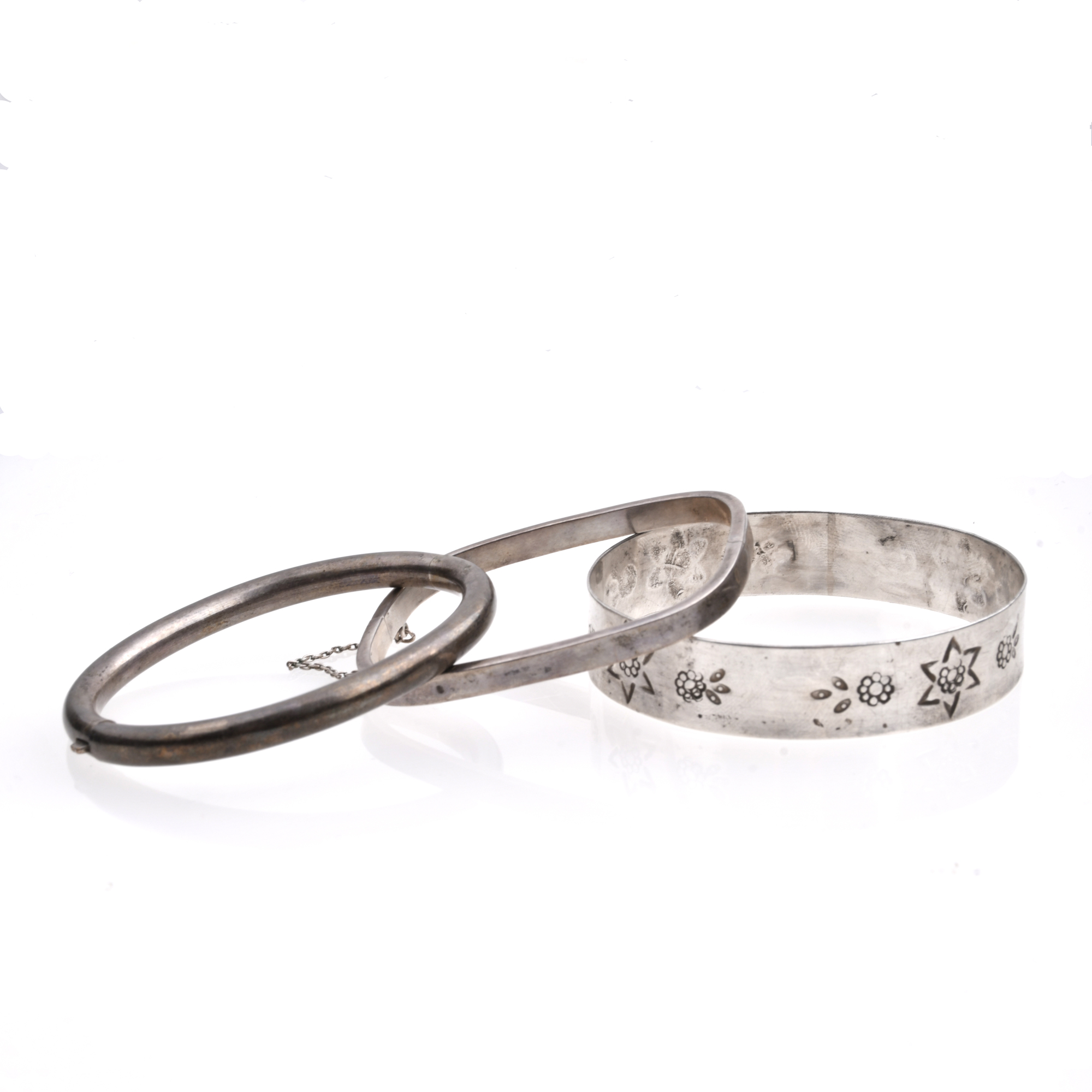 Set of three silver bracelets.