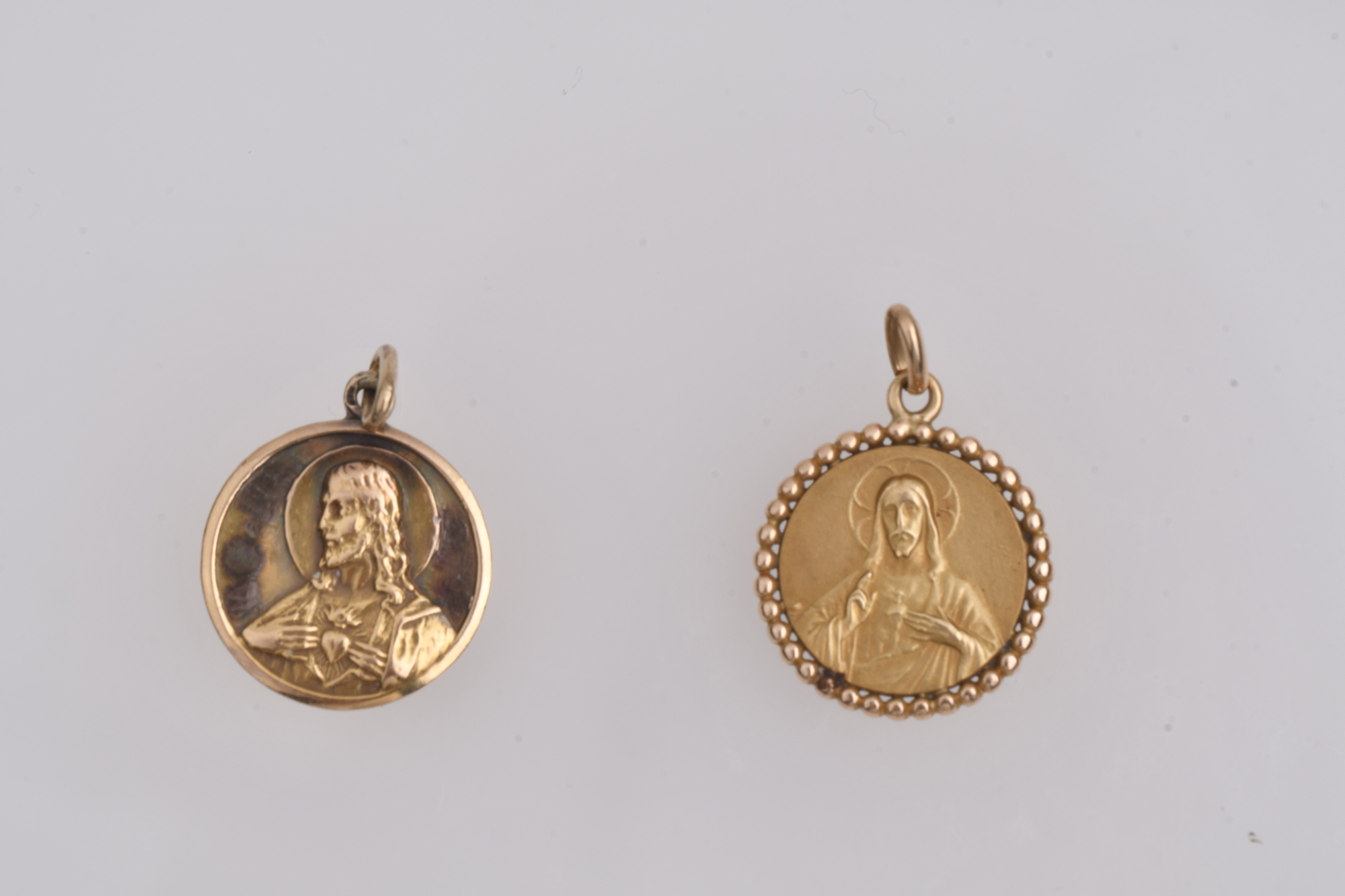 Pair of devotional pendants.