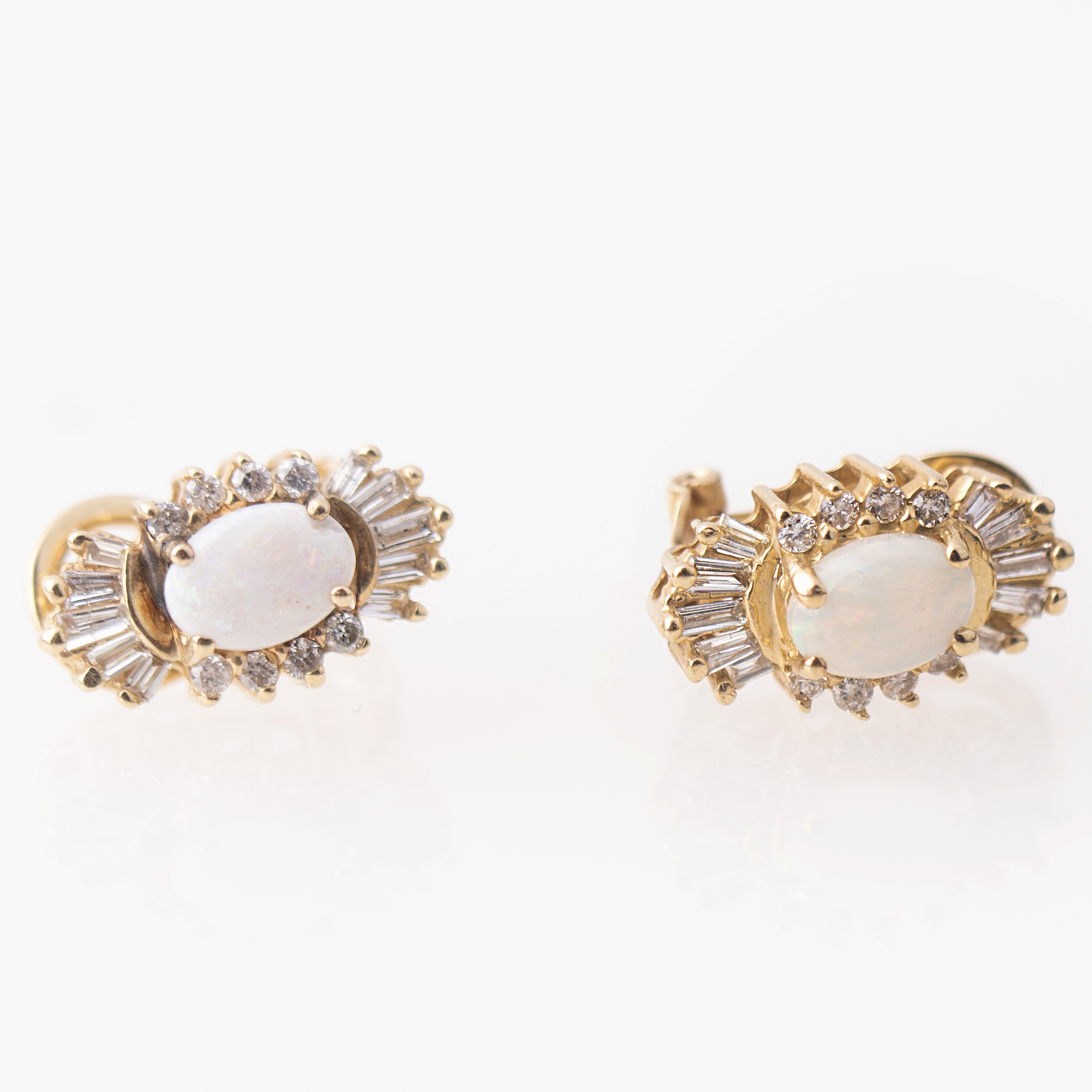 Earrings with white opal and diamonds.