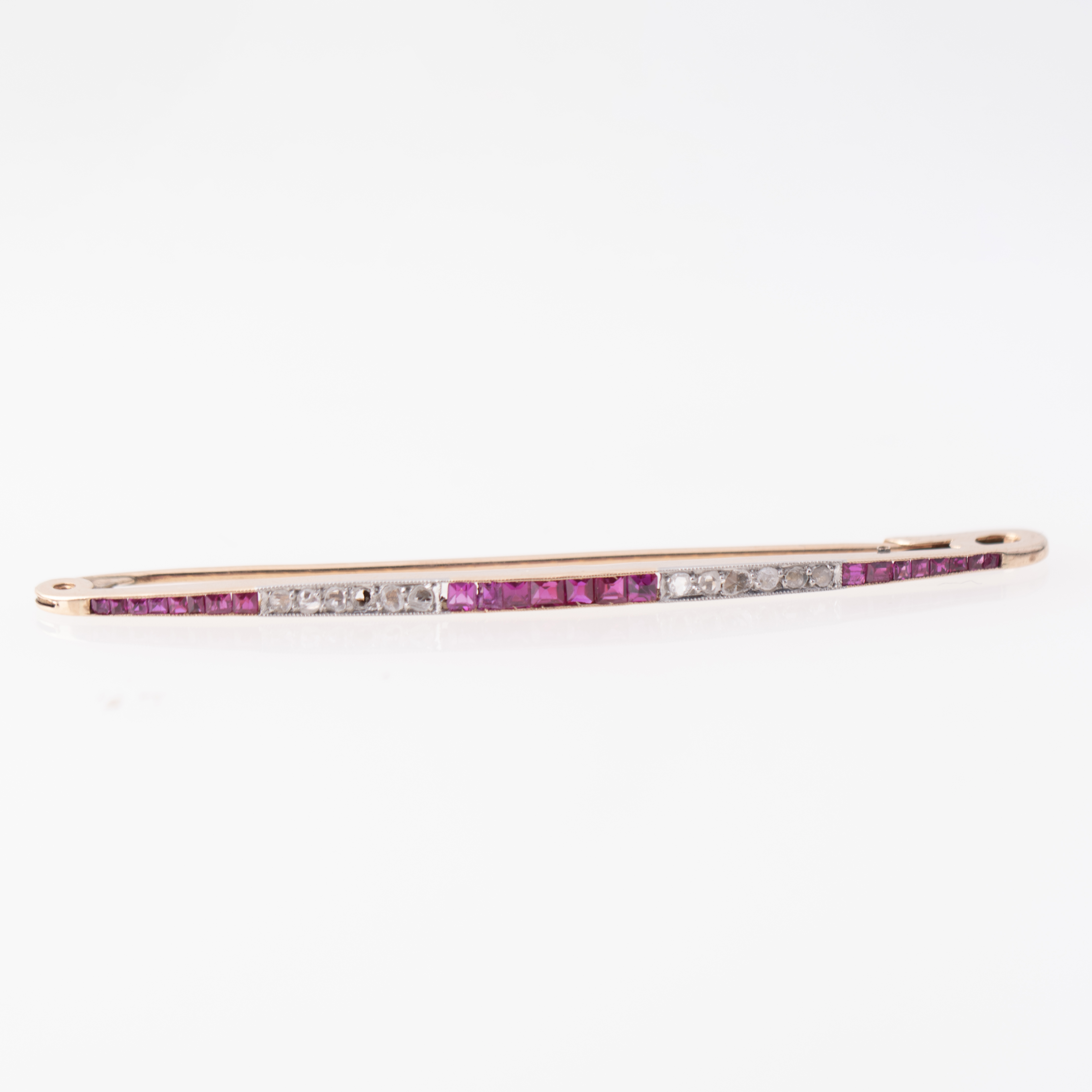 Tie pin with diamonds and rose topaz.