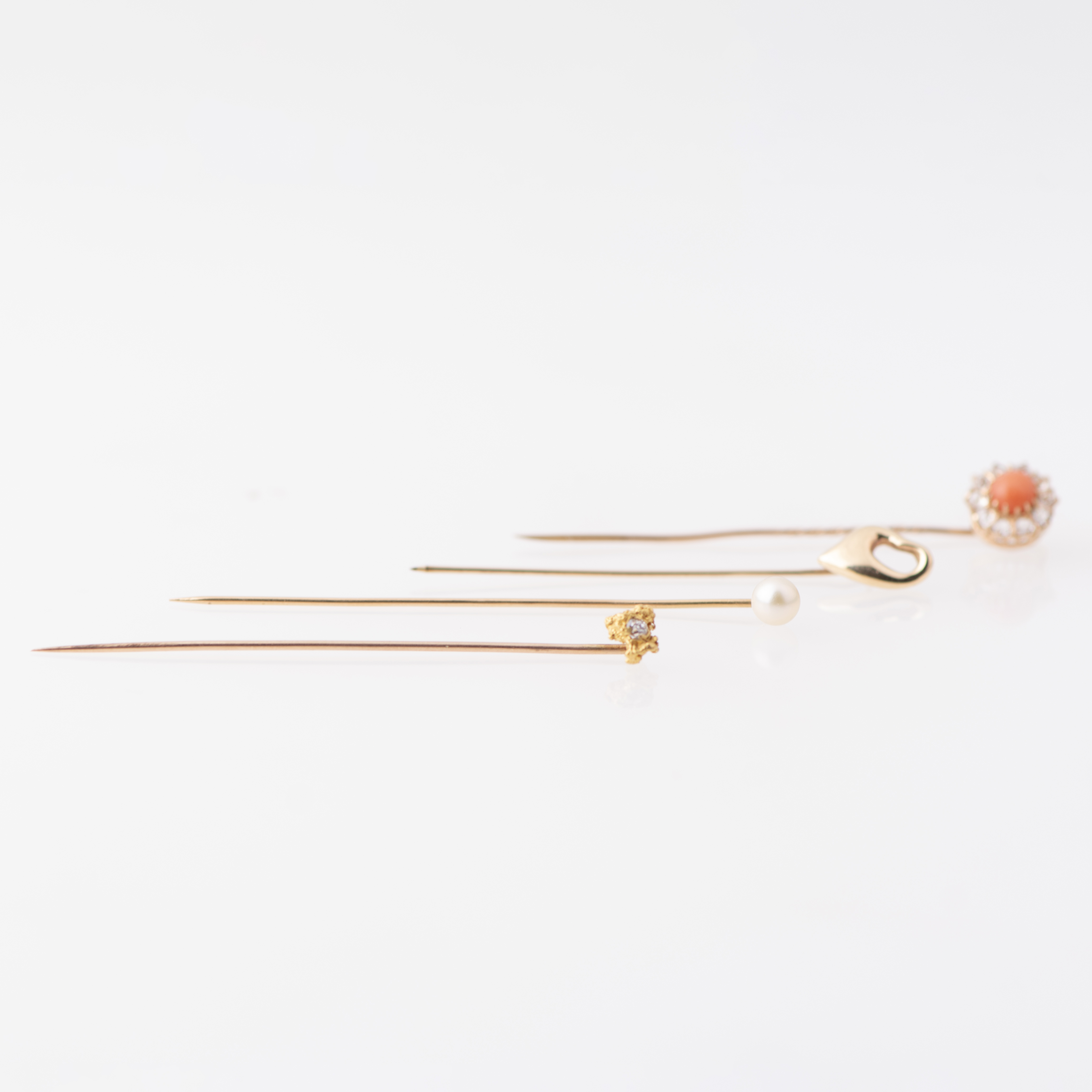 Set of four tie pins