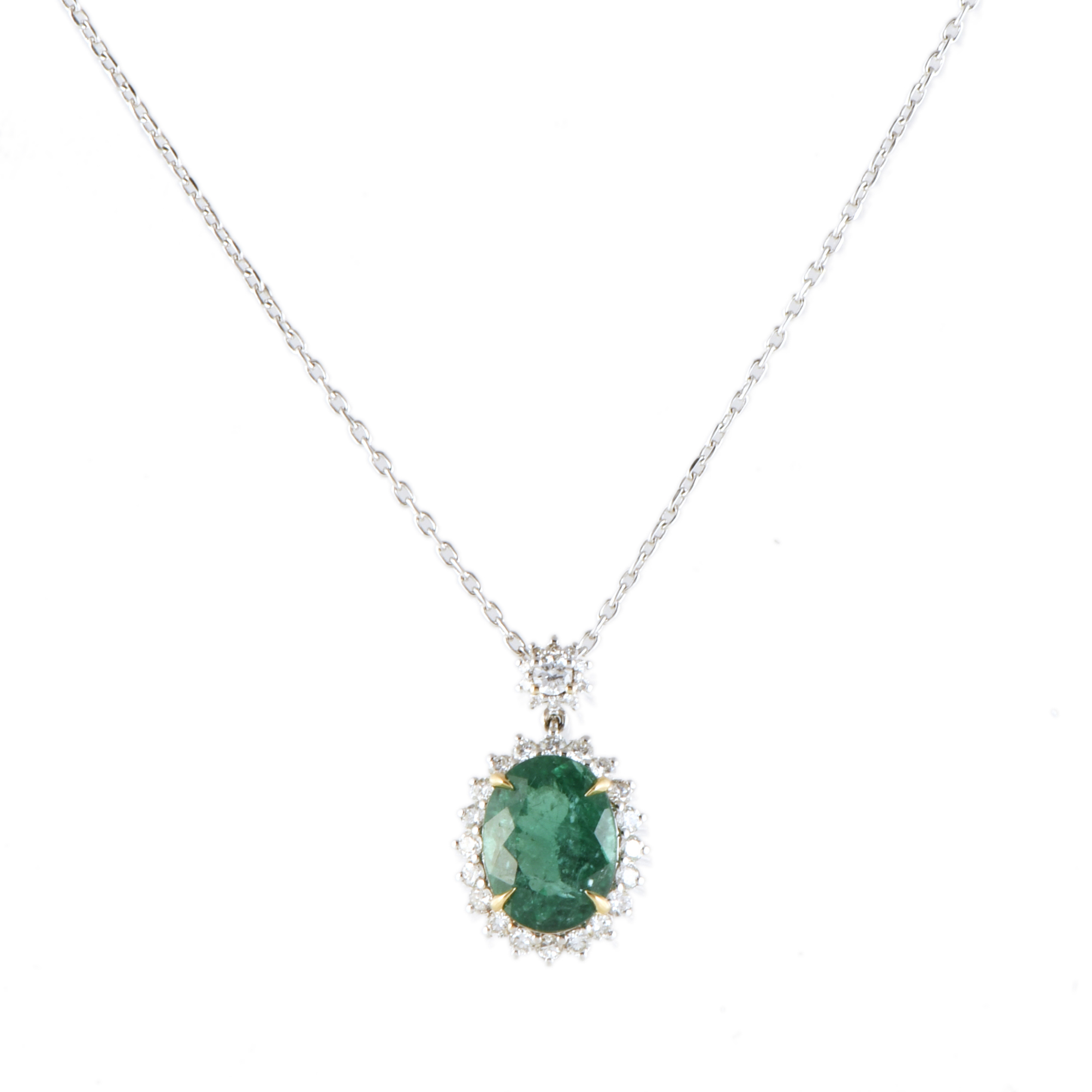 Necklace with emerald and diamonds rosette pendant.