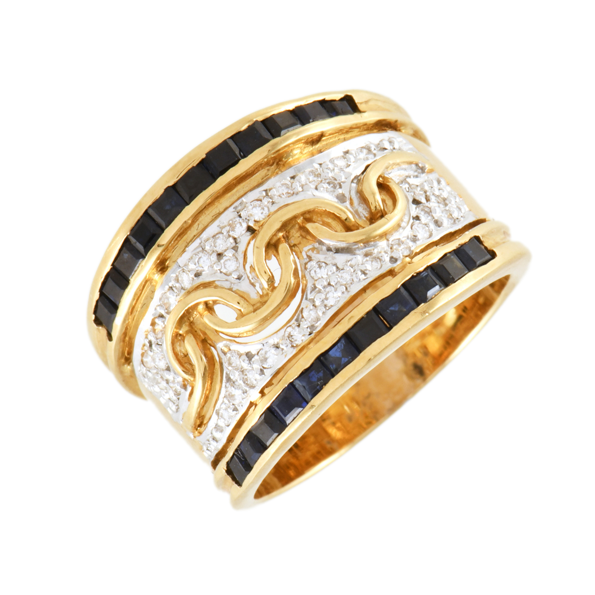 Anillo ancho con zafiros y diamantes.