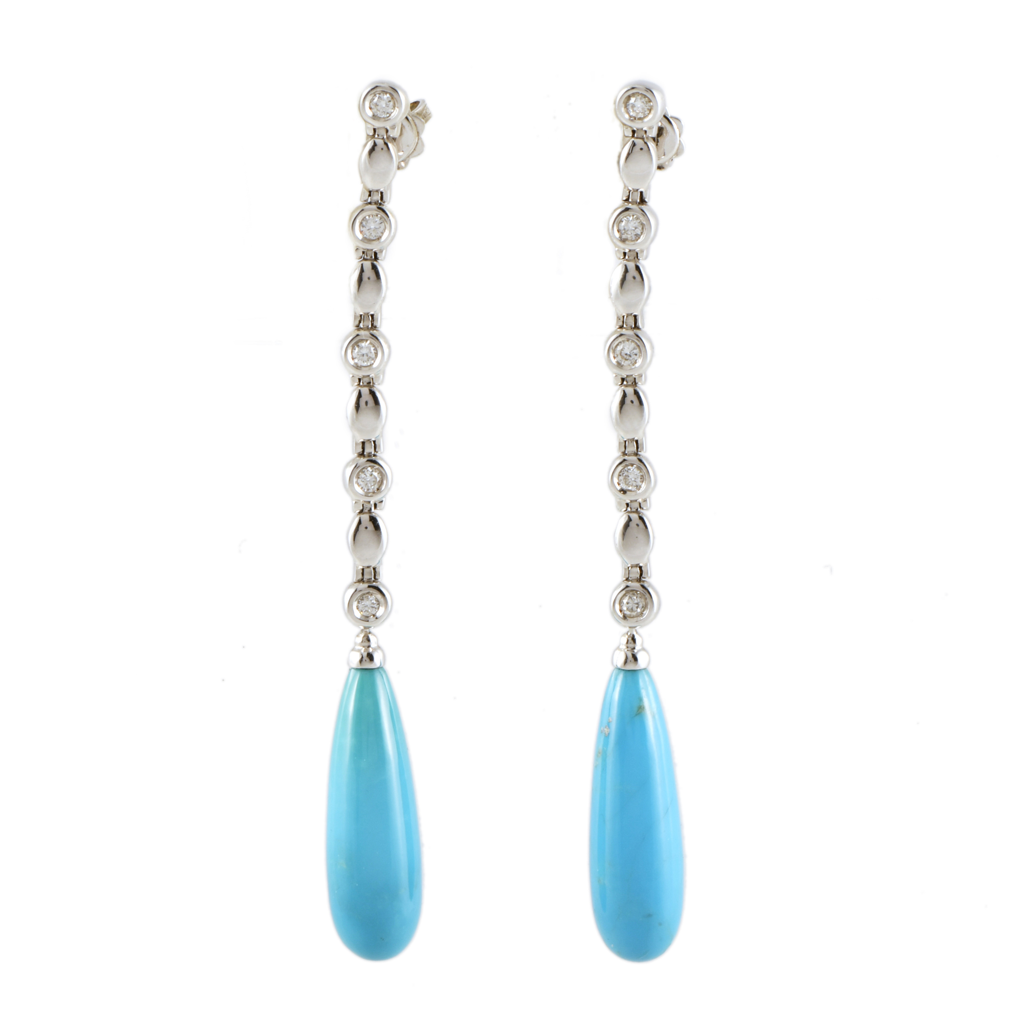 Pendientes largos con turquesas y diamantes.