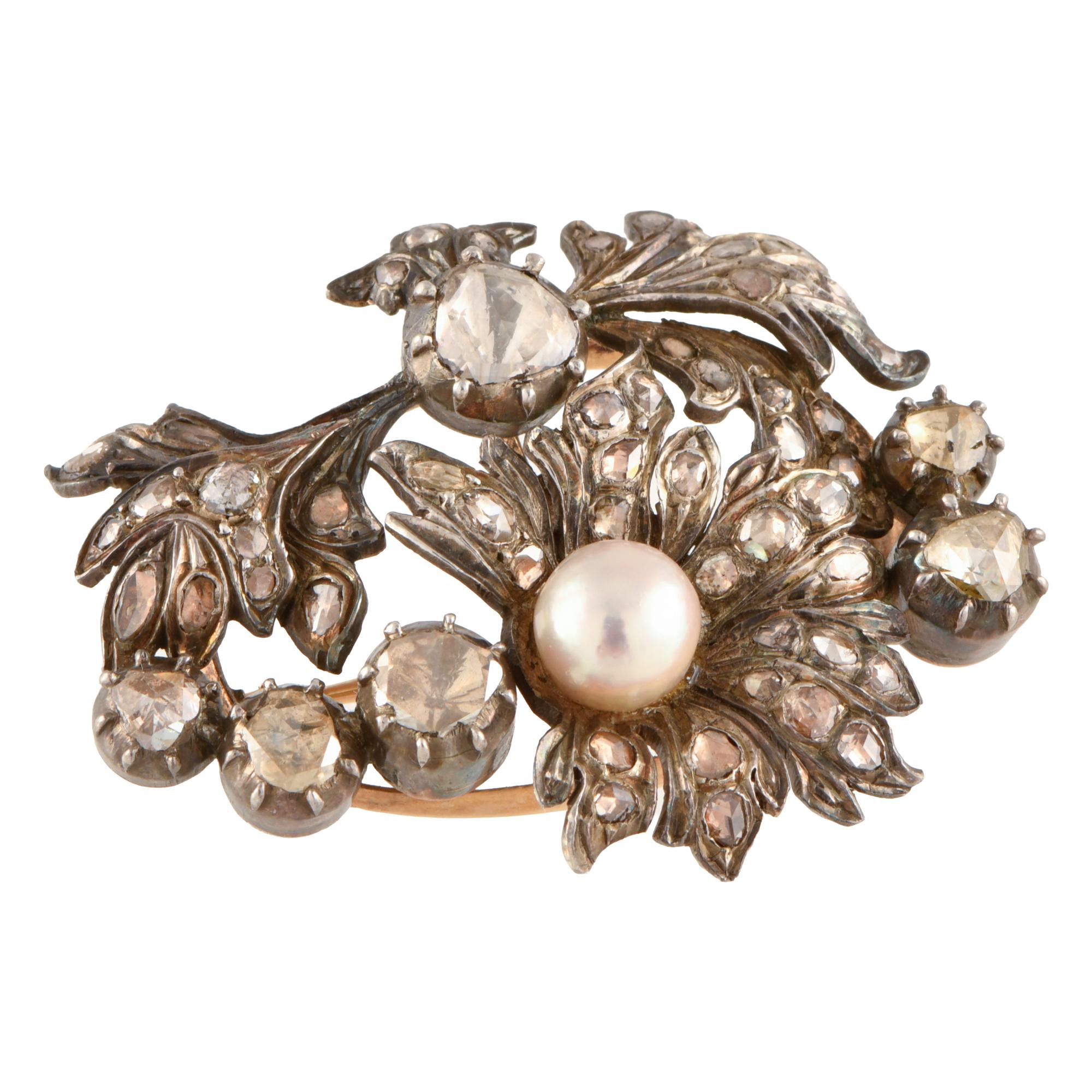 Broche floral belle époque con diamantes y perla.