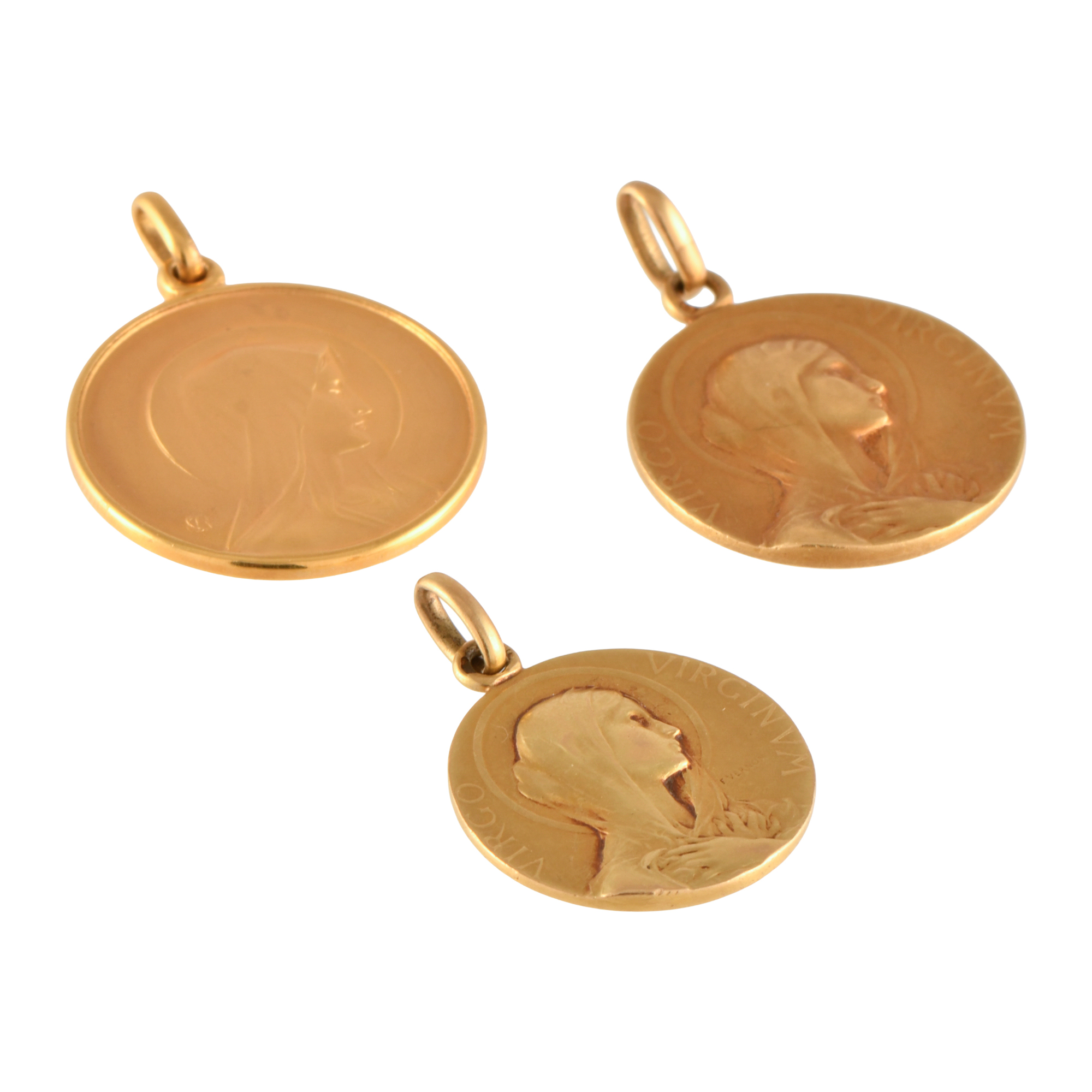 Lot of three devotional medals with the image of Madonna.
