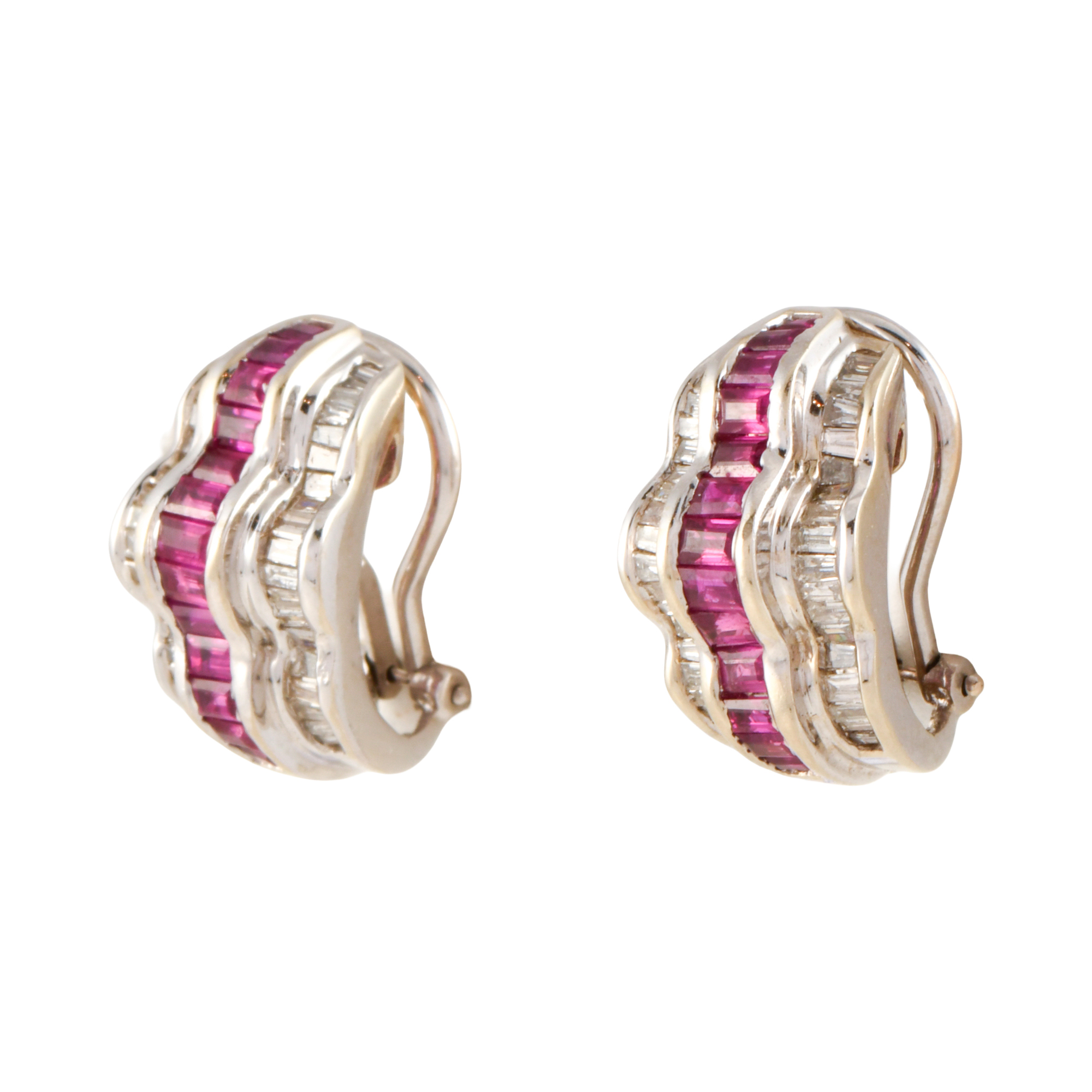 Earrings with three rows of rubies and diamonds.