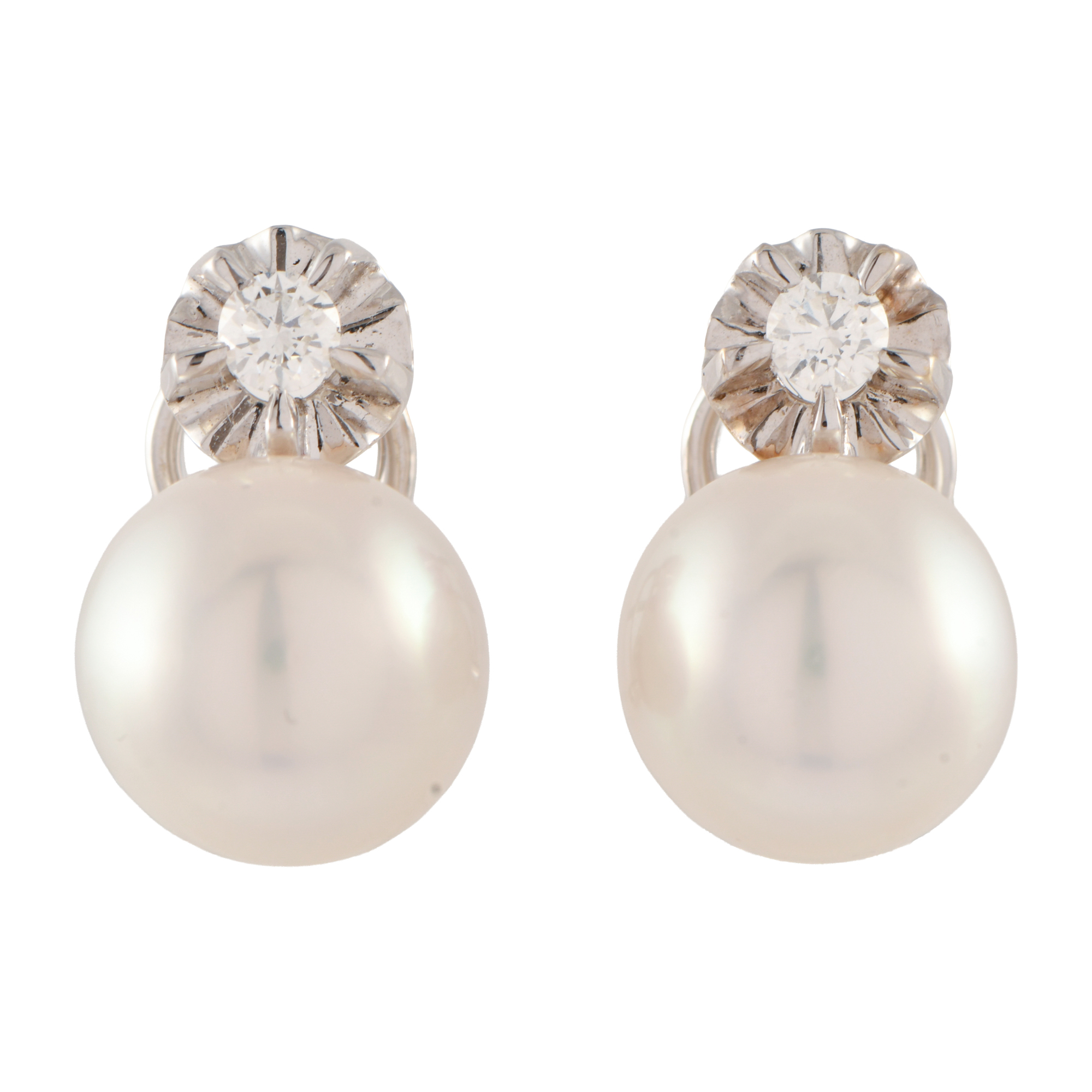 Pendientes tu y yo con perlas y diamantes. 