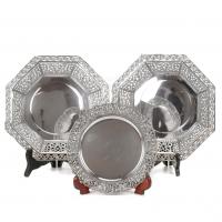 14-Two octogonal trays with fretwork border hallmarked by J. Roca; one round tray with fretwork border hallmarked.24 cm. diam. y 19,5 cm. diam.802 gr. 