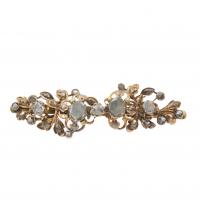 235-In silver and yellow gold, flower motives formed by rose-cut diamonds.6,5 cm.12,2 gr.