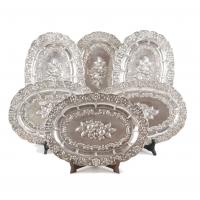 48-Oval trays embossed with floral decoration. 37 x 26 cm.1912 gr.Some hallmarked.Small dents. 