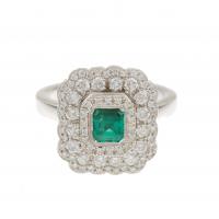 203-RING WITH DIAMONDS AND EMERALD.