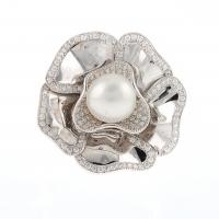 104-FLORAL RING WITH PEARL AND DIAMONDS.