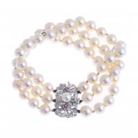 236-BRACELET WITH THREE STRANDS OF PEARLS, WHITE GOLD AND DIAMONDS.