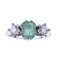 84-WHITE GOLD AND EMERALD RING.