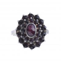 2-ROSETTE RING IN SILVER AND GARNETS.