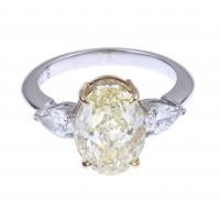 98-FANCY YELLOW OVAL RING OF 5.05 CTS., GIA CERTIFICATE.