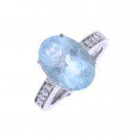63-WHITE GOLD RING WITH BLUE TOPAZ.