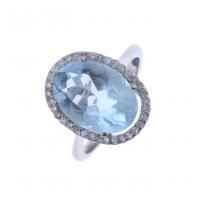 74-YELLOW GOLD RING WITH BLUE TOPAZ AND DIAMONDS.