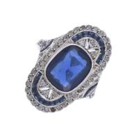 45-PLATINUM SHUTTLE RING WITH BLUE CORUNDUM AND SAPPHIRES.