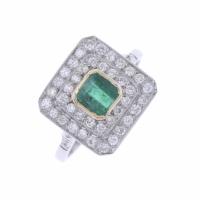 24-PLATINUM RING WITH EMERALD AND DIAMONDS.