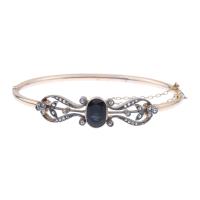 199-BELLE EPOQUE BANGLE BRACELET IN YELLOW GOLD WITH A SAPPHIRE.
