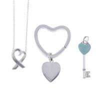 113-TIFFANY & CO. TWO PENDANTS AND A KEY RING.