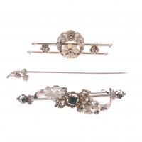 177-TWO OLD BROOCHES AND A NEEDLE.