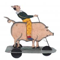 493-"PIG WITH A CLOWN", TOY DRAGSTER, SECOND HALF OF THE 20TH CENTURY.