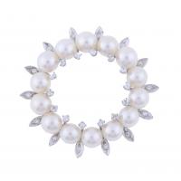 283-ROUND BROOCH WITH PEARLS AND DIAMONDS.